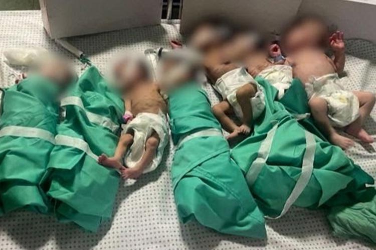 Tampak bayi-bayi di rumah sakit Al-Shifa dijadikan satu dalam satu tempat tidur dengan dibungkus kertas timah dan disanding dengan air hangat agar tetap hidup. (FOTO: CNN)
