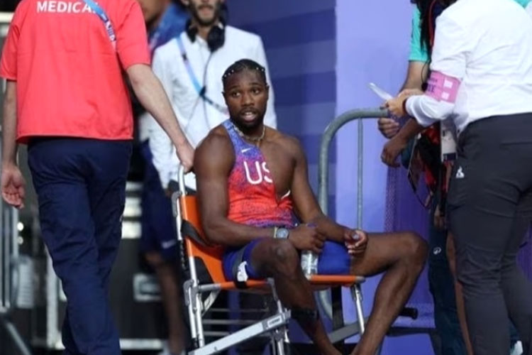 Sprinter AS, Noah Lyles positif Covid-19, naik kursi roda usai merebut medali perunggu. (FOTO: Getty Image)