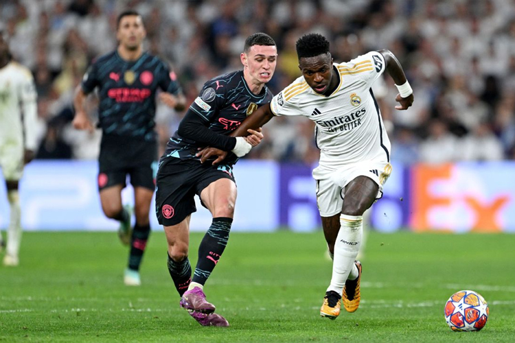 Juara bertahan Liga Champions Real Madrid akan kembali berhadapan dengan juara Liga Champions 2023, Manchester City, dalam laga playoff fase gugur. (foto: ESPN)