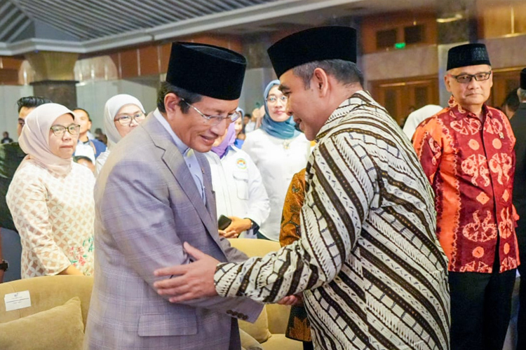 Menag bersama Ketua MPR RI Akhmad Muzani pada acara Munas IKA-PMII, Jumat (21/2/2025). (Foto: Kemenag RI)